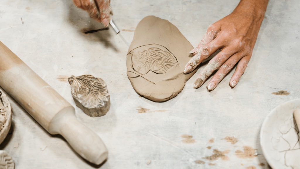 a man doing clay sculpting