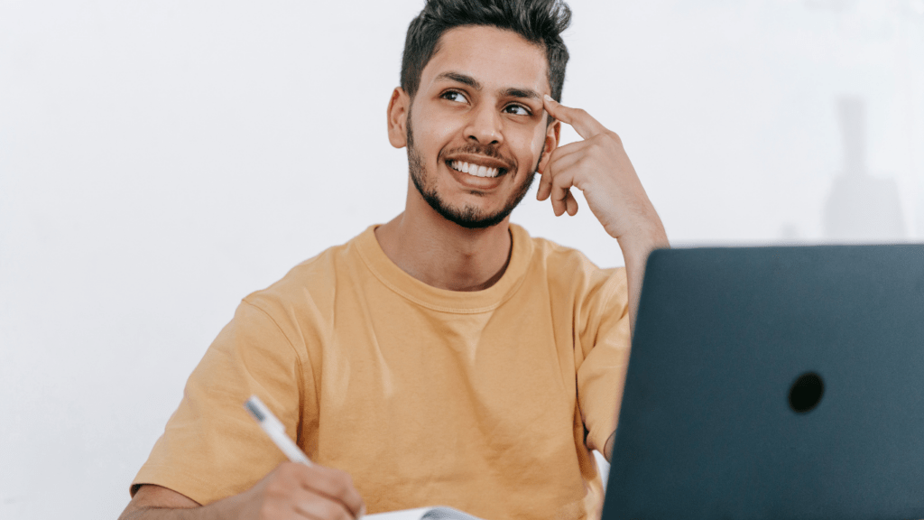 a man writing a blog content