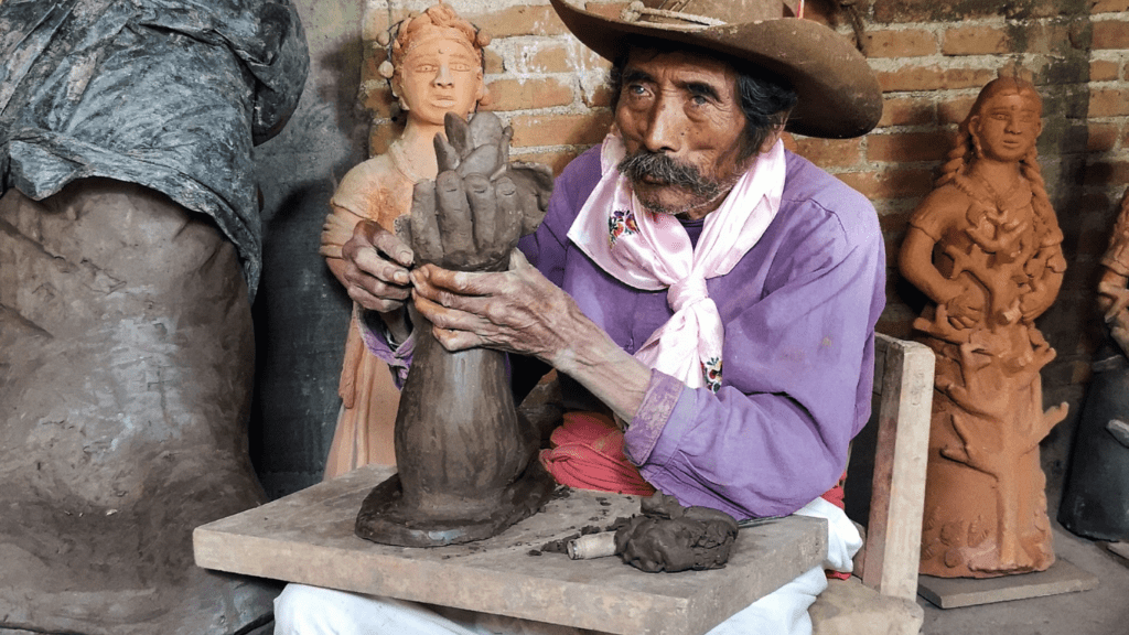 a man doing a sculpture