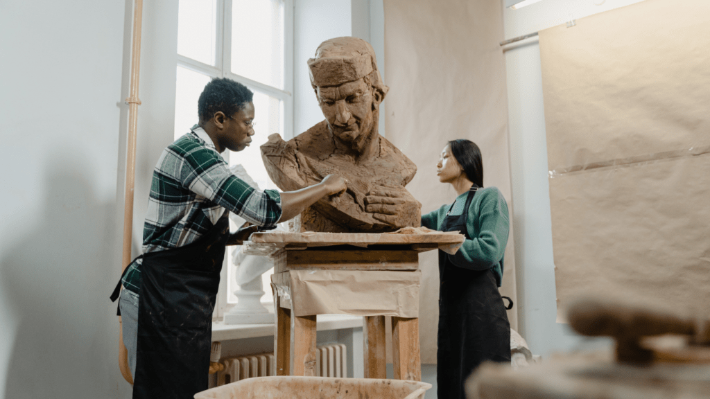 two people creating a sculpture together