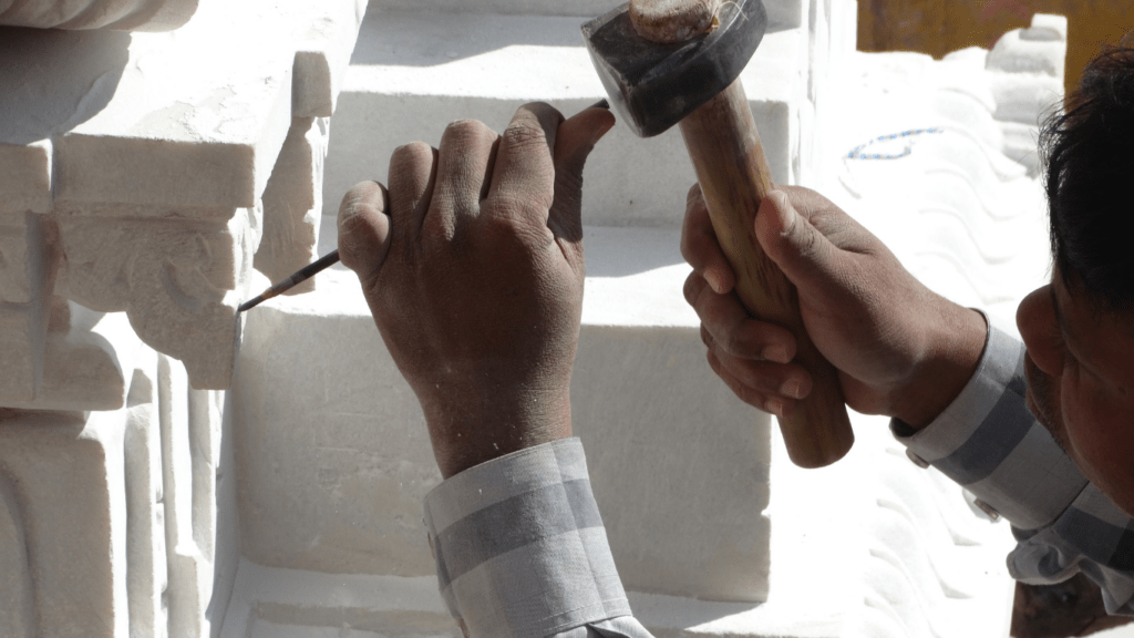 a man carving stone