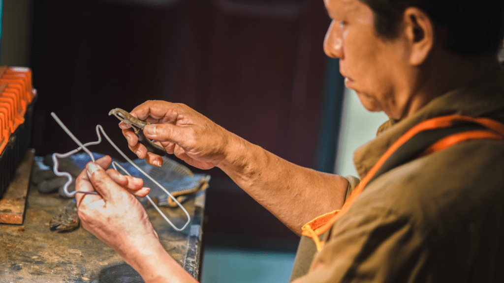 man doing metal sculpting