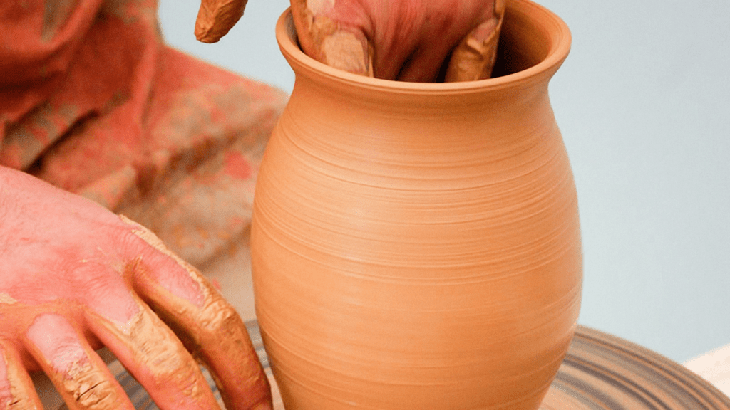 a man doing a clay sculpture