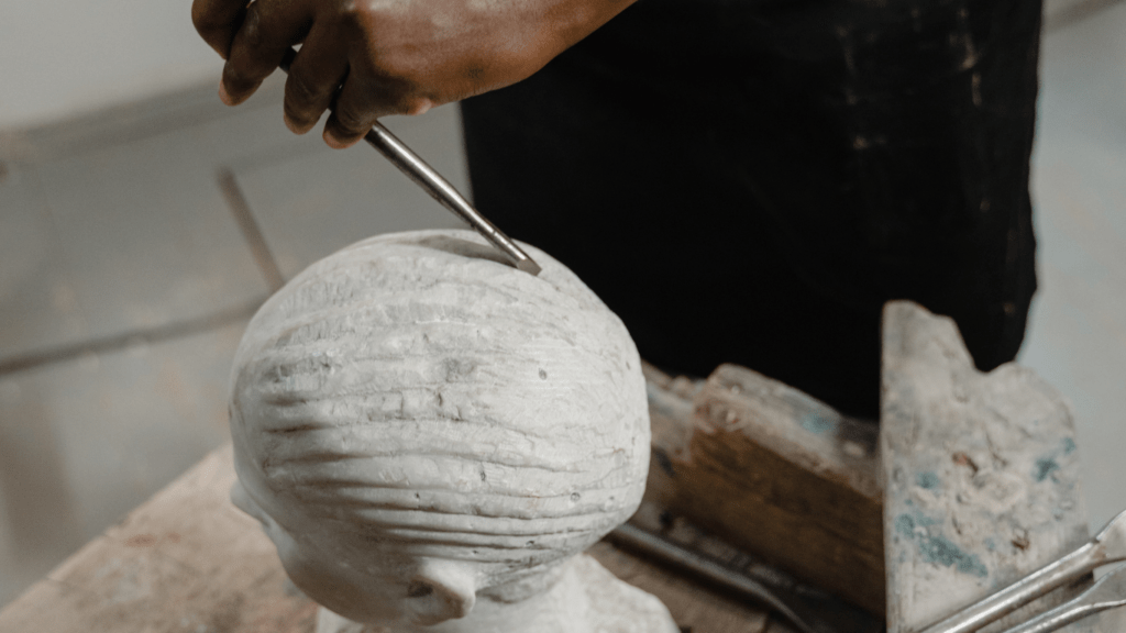 a man doing stone sculpting