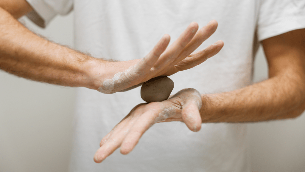 a man molding a clay