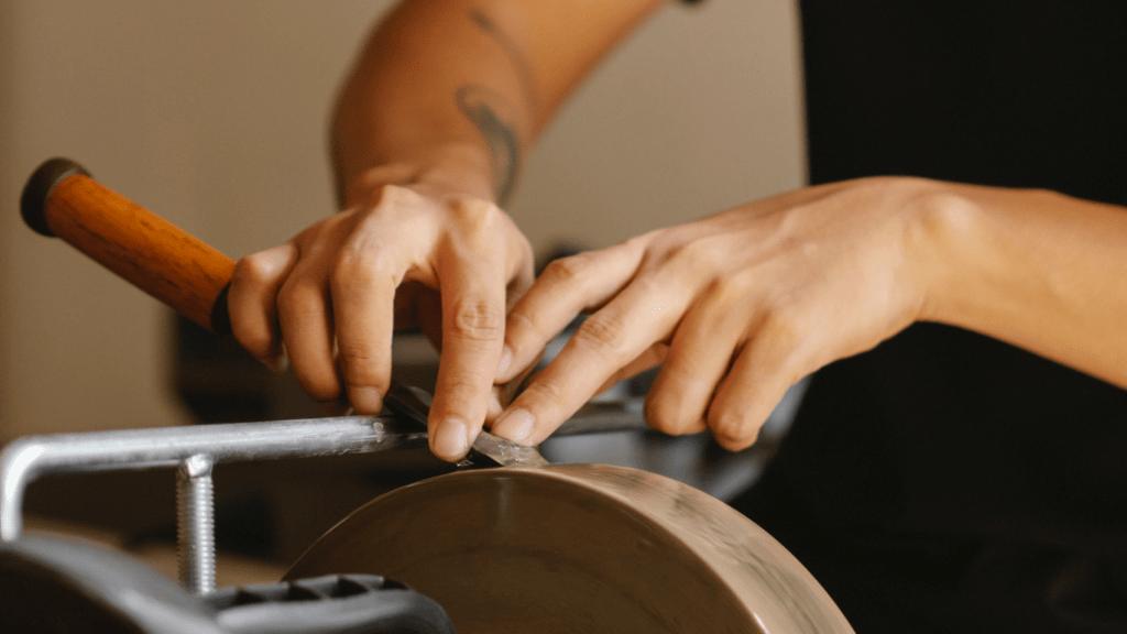 a man refurnishing the texture of a wood