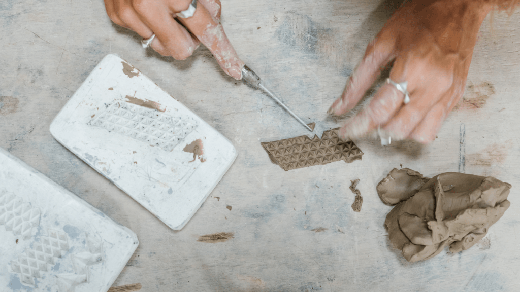 a man sculpting clay